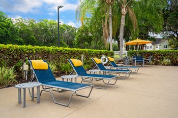 Lounge Chairs With Pillows At The Pool Sundeck